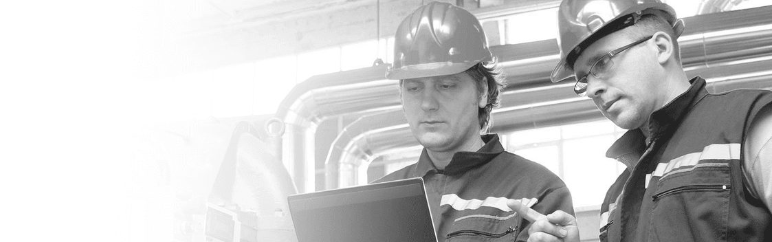 Two Men Wearing Hard Hats Looking at Clipboard